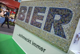 Beer always tastes good at a German brewers' stand at the Green Week, Berlin, 21 January 2014,