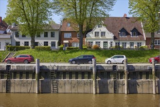 Houses and harbour basin in Toenning harbour, Nordfriesland district, Schleswig-Holstein, Germany,