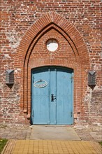 Entrance door to St Laurentius Church in Toenning, North Friesland district, Schleswig-Holstein,