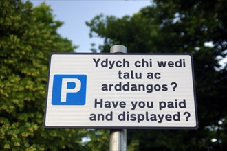 Welsh and English language on a sign in a car park, Wales, Great Britain