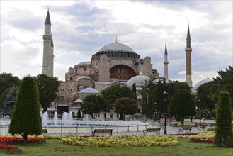 The Hagia Sophia, visible via bubbling water fountains and surrounded by green spaces, Istanbul