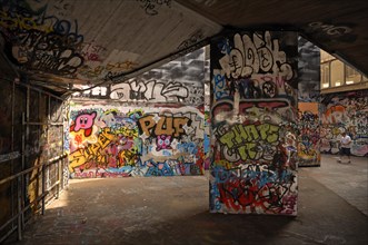 Graffiti walls in a skateboard park on the Thames, London, England, Great Britain