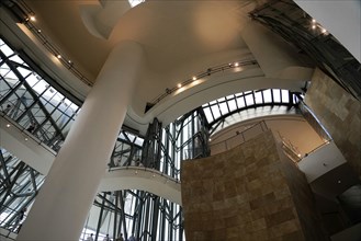 Guggenheim Museum Bilbao, Spain, Europe, The interior features a large atrium with tall pillars and