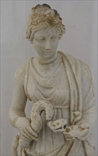 Small statue, Goddess Hygieia with snake, marble sculpture of a woman with snake, dressed in