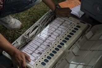 Barpeta, India. 6 May 2024. Polling officials check Electronic Voting Machines (EVMs) before