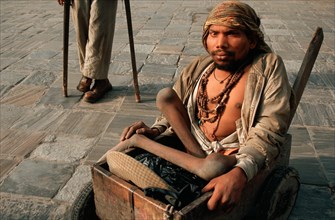 Beggars suffering from physical disabilities, handicapped persons in a street, Kathmandu, Nepal,
