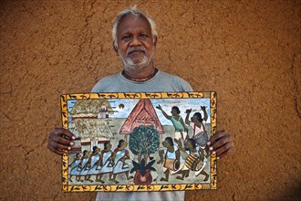 Pyatkar painter showing one of his painting, traditional art form from Jharkhand, India, Asia