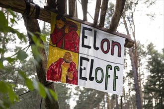 Banner Elon / Eloff from an internet meme in the occupied forest section Tesla Stop . The