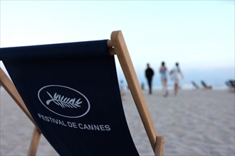 Cannes, France, 13.5.2024: Deckchairs with the inscription Festival de Cannes stand on the beach