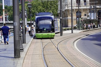 On the way in Bilbao, Province of Bizkaia, Basque Country, Spain, Europe, Green-blue coloured tram