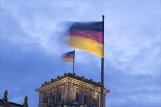 Fluttering German flags on the Reichstag in Berlin, on the blue hour, 13/02/2014, Berlin, Germany,