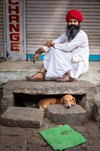 Portrait of a Indian man with his dog, Jodhpur, Rajasthan, India, Asia