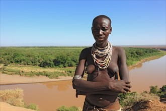 South Ethiopia, Omo region, Omo river landscape, proud woman of the Karo people with necklace,