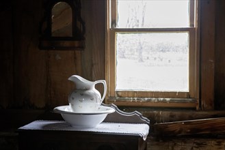 Fort Dodge, Iowa, A pitcher and washbasin in a bedroom at the Carlson-Richey Cabin at the Fort
