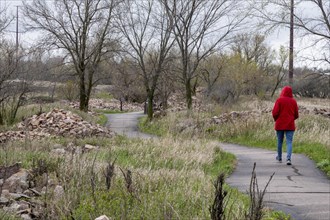 Pipestone, Minnesota, A tourist walks along a path by active quarries at Pipestone National