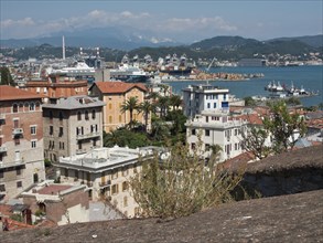 View of the urban skyline of a harbour city with buildings and the sea, Bari, Italy, Europe