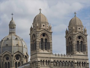 Detailed view of historic cathedral towers and dome in overcast sky, historic cathedral with two