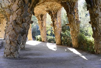 Park Gueell, Barcelona, Catalonia, Spain, Europe, Light and shadow under stone arches in a park,