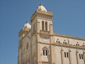 Historic church with impressive architecture and domes under a clear sky, Tunis in Africa with