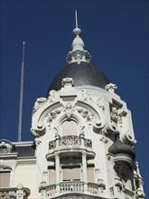 Detail of a historic building with an elaborate dome under a blue sky, Madrid, Spain, Europe