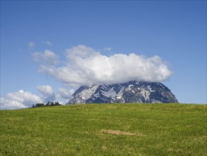 Meadow, clouds over mountain peak, Grimming, near Aigen im Ennstal, Styria, Austria, Europe