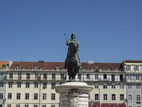 Statue of a man on a horse in front of historical buildings, Lisbon, Portugal, Europe