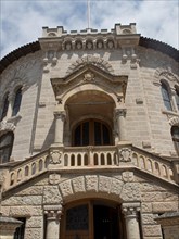 Historic stone building with balcony, ornate windows and entrance, Monte Carlo, Monaco, Europe