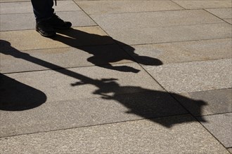 Man taking a selfie with a mobile phone, Shadow, Germany, Europe