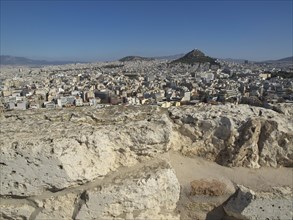 Panoramic view of a city and surrounding mountains from ancient ruins, Ancient buildings with