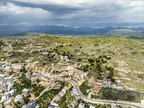 Fields and Mountains from a drone over Lekursi Castle on Lekursi Hill over Saranada, Albanian