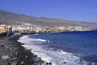 Black volcanic beach in Candelaria, Tenerife, Canary Islands, Spain, Europe, View of a coastal town