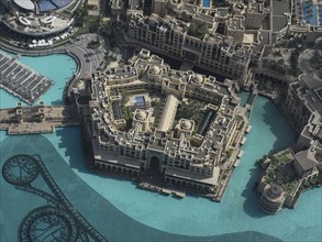 Close-up of a square building complex, surrounded by water, by day, Dubai, Arab Emirates