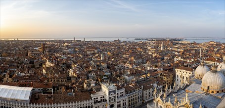 View over the roofs of Venice with St Mark's Basilica and Doge's Palace in the evening light, view