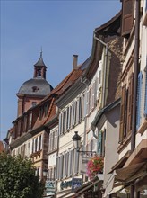 Historic half-timbered houses with floral decorations in Alsace, Wissembourg, France, Europe