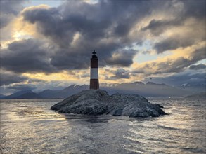 Lighthouse Faro Les Eclaireurs at sunset, dramatic clouds, Beagle Channel, Tierra del Fuego, Tierra