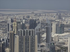 View of a city with modern skyscrapers and high-rise buildings under a clear blue sky, view of a