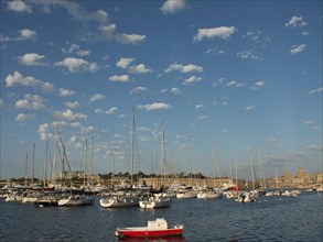 Crowded harbour with yachts and sailboats under a cloudy sky, Valetta, Malta, Europe