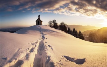 Footprints in fresh snow on a hill to a small chapel backlit in winter, AI generated, AI generated