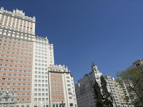 Modern skyscrapers and tall buildings against the clear blue sky in an urban landscape, Madrid,