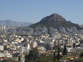 City view with buildings and a hill in the background in clear weather, Ancient buildings with