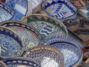 Colourfully painted, traditional ceramic bowls and plates with various patterns, Tunis in Africa