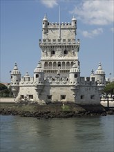 Historic moated castle with imposing towers on a headland, Lisbon, Portugal, Europe