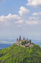 Hohenzollern Castle near Hechingen, cloudy sky, Zollernalbkreis, Swabian Alb, Baden-Wuerttemberg,