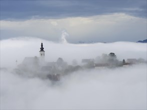 Church rises out of the morning mist, Frauenberg pilgrimage church, near Leibnitz, Styria, Austria,