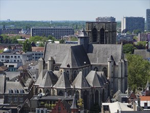 Medieval church with prominent towers and surrounding buildings in a city view, medieval city with