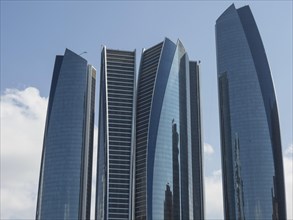 Modern skyscrapers with glass facades rise into the sky, Abu Dhabi, United Arab Emirates, Asia