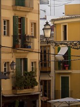 Colourful city facades with windows, balconies and a decorative lantern, palma de Majorca with its