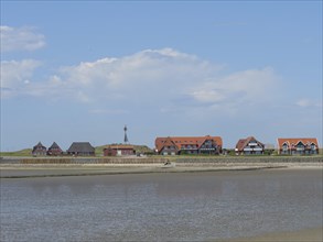 Coastal landscape with modern and traditional houses along the coast, Baltrum Germany