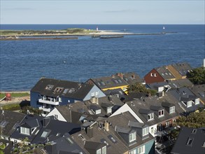 View of roofs of houses and the sea with an island in the background, Helgoland, germany