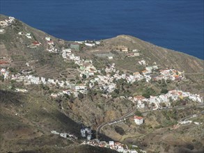 Village on a ridge overlooking the sea, tenerife, spain